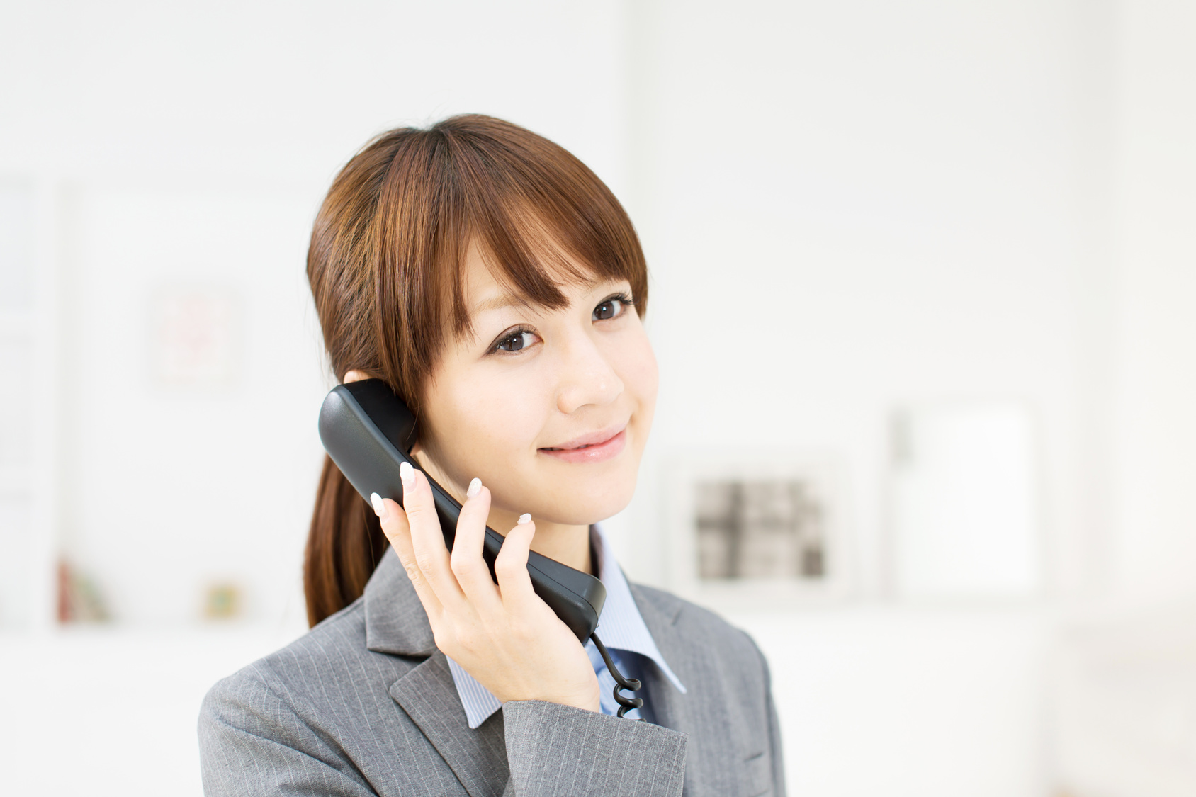 Beautiful young businesswoman working in office